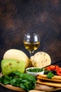 A pile of cheese heads, vegetables, fruits, cookies and nuts on table Royalty Free Stock Photo