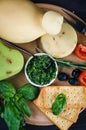 A pile of cheese heads, vegetables, fruits, cookies and nuts on table Royalty Free Stock Photo