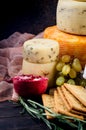 A pile of cheese heads, vegetables, fruits, cookies and nuts on table Royalty Free Stock Photo