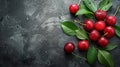 Pile of cherry with leaf and water drops on black stone table. Ripe ripe cherries. Royalty Free Stock Photo