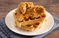 Pile of Chicken and Waffles on a Rustic Wooden Counter Royalty Free Stock Photo