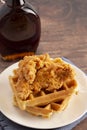 Pile of Chicken and Waffles on a Rustic Wooden Counter Royalty Free Stock Photo