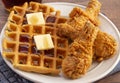 Pile of Chicken and Waffles on a Rustic Wooden Counter Royalty Free Stock Photo