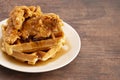 Pile of Chicken and Waffles on a Rustic Wooden Counter Royalty Free Stock Photo