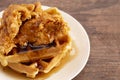 Pile of Chicken and Waffles on a Rustic Wooden Counter Royalty Free Stock Photo