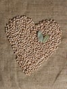 Pile of Chickpeas in Shape of Heart With Bay Leaves Royalty Free Stock Photo