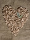Pile of Chickpeas in Shape of Heart With Bay Leaves Royalty Free Stock Photo