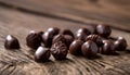 A pile of chocolate candies on a wooden table Royalty Free Stock Photo