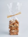 Pile of chocolate and hazelnut Biscotti Cantucci Biscuits Cookies in plastic wrap packaging for sale. Italian dessert cookies Royalty Free Stock Photo