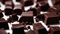 A pile of chocolate squares on a white surface