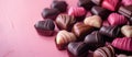 Pile of Chocolates on Pink Table Royalty Free Stock Photo