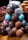 A pile of chocolates sitting on top of a wooden table, AI Royalty Free Stock Photo