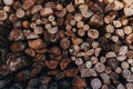 Pile of chopped stacked firewood in home backyard as background