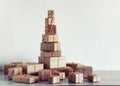 Pile of Christmas gifts wrapped in rustic paper