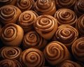 a pile of cinnamon rolls on a black background