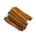 Pile of cinnamon sticks isolated on a white background. Royalty Free Stock Photo