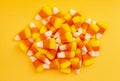 A Pile of Classic Candy Corn on Yellow Orange Background