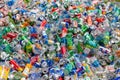 Pile of clear plastic bottle waste and beer cans on dump
