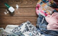 Pile of clothes with detergent and washing powder Royalty Free Stock Photo