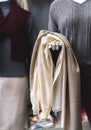 A piece of beige and brown fabric in a hand of a mannequin Royalty Free Stock Photo