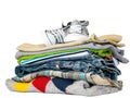 Pile of clothes and sneakers isolated on white Royalty Free Stock Photo