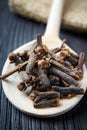 Pile cloves on wooden spoon Royalty Free Stock Photo