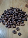 Pile Coffee Beans in Wooden Tabble