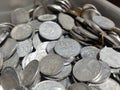 a pile of coins that are being calculated from savings Royalty Free Stock Photo