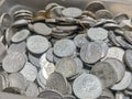 a pile of coins that are being calculated from savings Royalty Free Stock Photo