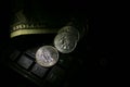 A pile of coins on a computer keyboard, making money on the Interne Royalty Free Stock Photo