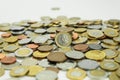 Pile of coins of different denominations on a white background Royalty Free Stock Photo