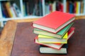 Pile of colored books on wooden desktop Royalty Free Stock Photo