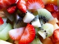 Pile of colored fruit and berries pieces, fruit salad Royalty Free Stock Photo