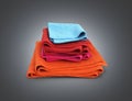 Pile of colored towels isolated on black gradient background 3d Royalty Free Stock Photo