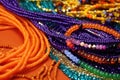 pile of colorful beaded necklaces on an orange surface Royalty Free Stock Photo