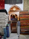 Pile of colorful Berber carpets in shop in Medina of Marrakech, Morocco. Royalty Free Stock Photo