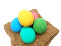 Pile of colorful century or potash preserved eggs on brown sackcloth