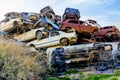 Pile of colorful discarded cars on junkyard in israel Royalty Free Stock Photo