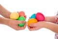 Pile of colorful easter eggs in two child hands