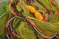 Pile of colorful fishing net, rope and floats on the fishermen`s pier Royalty Free Stock Photo