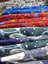 pile of colorful hanging shirts  on abstract background Royalty Free Stock Photo