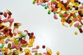 Pile of colorful jelly sweets made from fruit juice, gelatin and sugar in corners isolated over white background Royalty Free Stock Photo