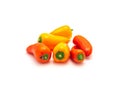 Pile of colorful orange and red mini sweet peppers snack isolate on white Royalty Free Stock Photo