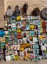 Pile of colorful paintings including famous people's portraits selling on the streets of Marrakech