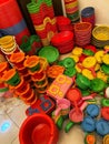 A pile of colorful plastic plates and bowls. Beautiful picture of colorful plastic.