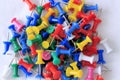 A Pile of Colorful Push Pins on a White Background Royalty Free Stock Photo