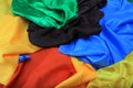 Pile of colorful silk fabrics. Crumpled patches of vibrant color Royalty Free Stock Photo