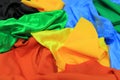 Pile of colorful silk fabrics. Mix of vibrant colors as background. Royalty Free Stock Photo