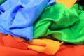 Pile of colorful silk fabrics. Mix of vibrant colors as background Royalty Free Stock Photo