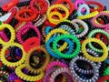 A pile of colorful spiral rubber bands. Elastic hair ties in vibrant colors. Royalty Free Stock Photo